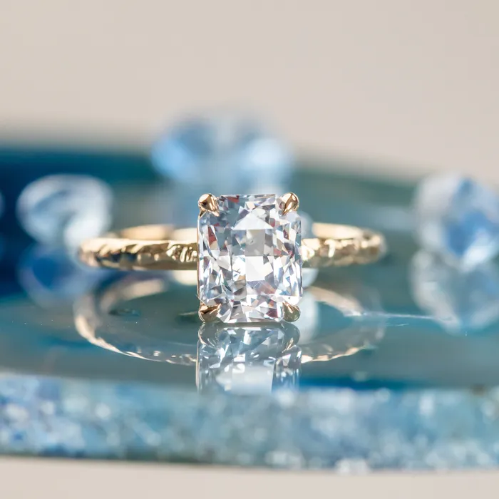 305ct Radiant Cut Sapphire Evergreen Solitaire in 14k Yellow Gold Tucson Show Earrings