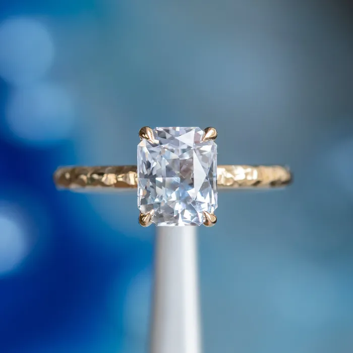 305ct Radiant Cut Sapphire Evergreen Solitaire in 14k Yellow Gold Tucson Show Earrings