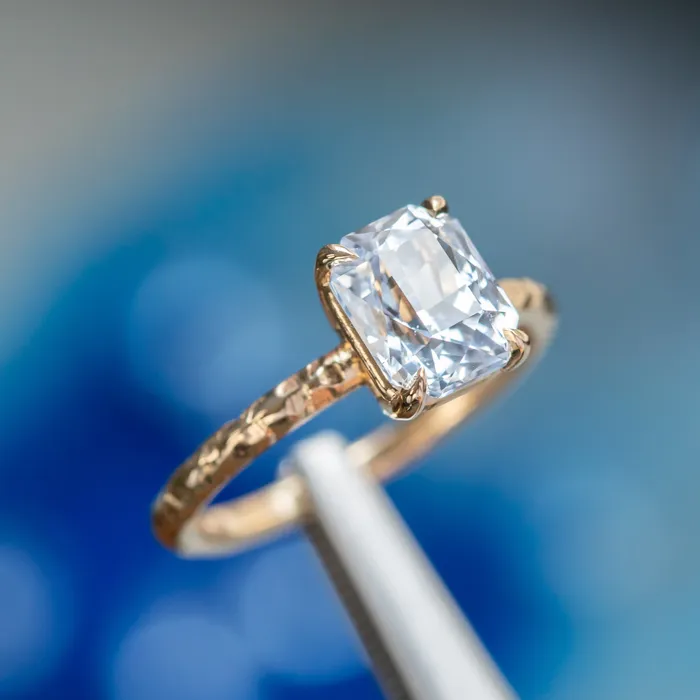305ct Radiant Cut Sapphire Evergreen Solitaire in 14k Yellow Gold Tucson Show Earrings