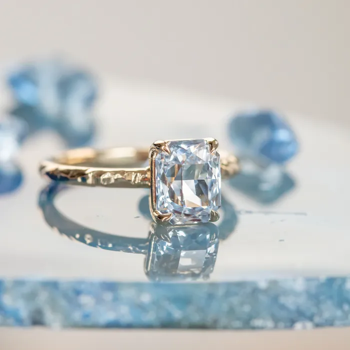305ct Radiant Cut Sapphire Evergreen Solitaire in 14k Yellow Gold Tucson Show Earrings